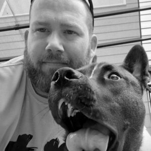 A picture of Micah Ennis and his dog