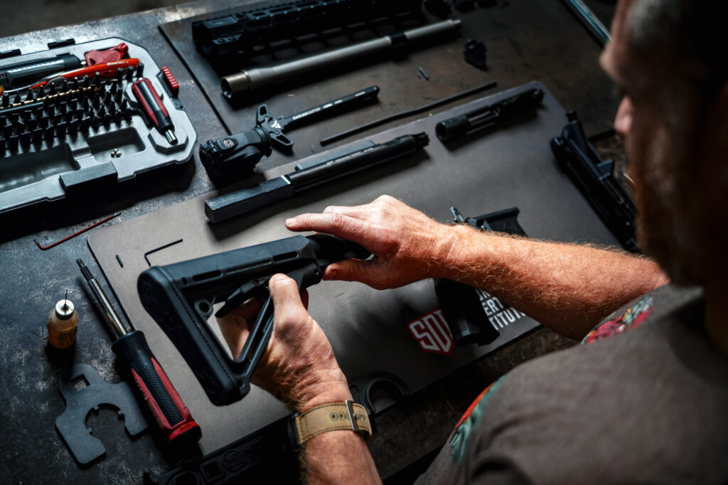 A firearm being assembled